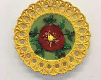 Decorative plate with red flower