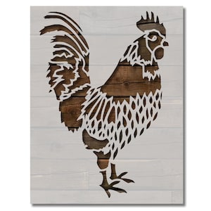 May include: A rustic wall art piece featuring a rooster silhouette. The rooster is cut out of a dark brown wood grain, set against a backdrop of white-painted wooden planks. The artwork has a farmhouse or country theme.