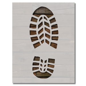 May include: A white wooden sign with a cutout of a boot print. The boot print is on a brown wood background.