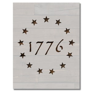 May include: Wooden sign with a light gray background and a design featuring the year "1776" in a dark brown font, surrounded by a circle of dark brown stars. The sign has a rustic, distressed appearance.