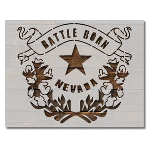 May include: A black and white stencil of the State of Nevada seal. The seal features a five-pointed star, a banner with the words "Battle Born" and the word "Nevada" below the star.