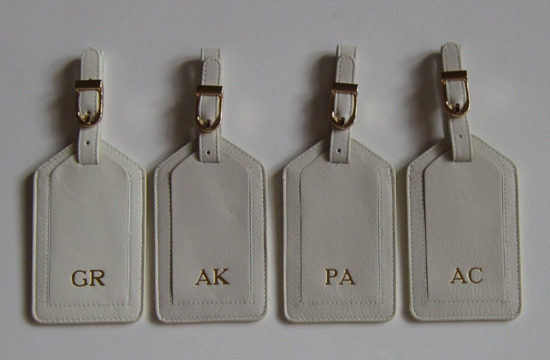 Monogrammed Genuine Leather Luggage Tags with initials or names.
We offer gold and silver buckles.
There is a pocket under the flap to keep your personal information.