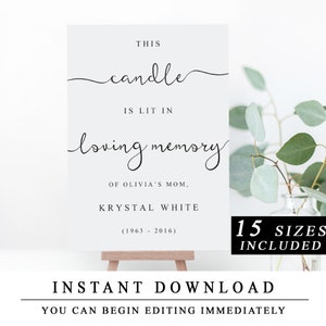 以下が含まれることがあります： 「This candle is lit in loving memory of Olivia's Mom, Krystal White (1963 - 2016)」というテキストが書かれた印刷可能なサイン。サインは小さなイーゼルに置かれており、背景には緑の葉が写っています。