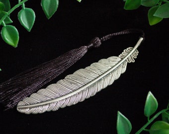 Silver tone feather bookmark with black tassel