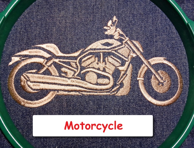 May include: Embroidered image of a motorcycle on a blue denim background. The motorcycle is outlined in a copper colour and the word "Motorcycle" is written in red below the image.
