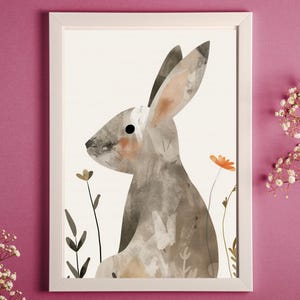 May include: A watercolour illustration of a grey rabbit sitting in a field of flowers. The rabbit has a long, floppy ear and a small, black eye. The flowers are a variety of colours, including orange, yellow, and green.