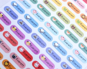 May include: A sheet of colorful oval-shaped stickers with various animal illustrations. Each sticker has the name "Everett" printed in black text.