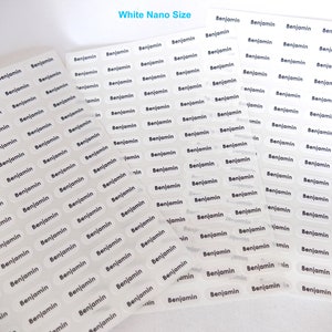 May include: A sheet of white, transparent labels with the name "Benjamin" printed in black on each label. The labels are in a nano size and are arranged in rows and columns.