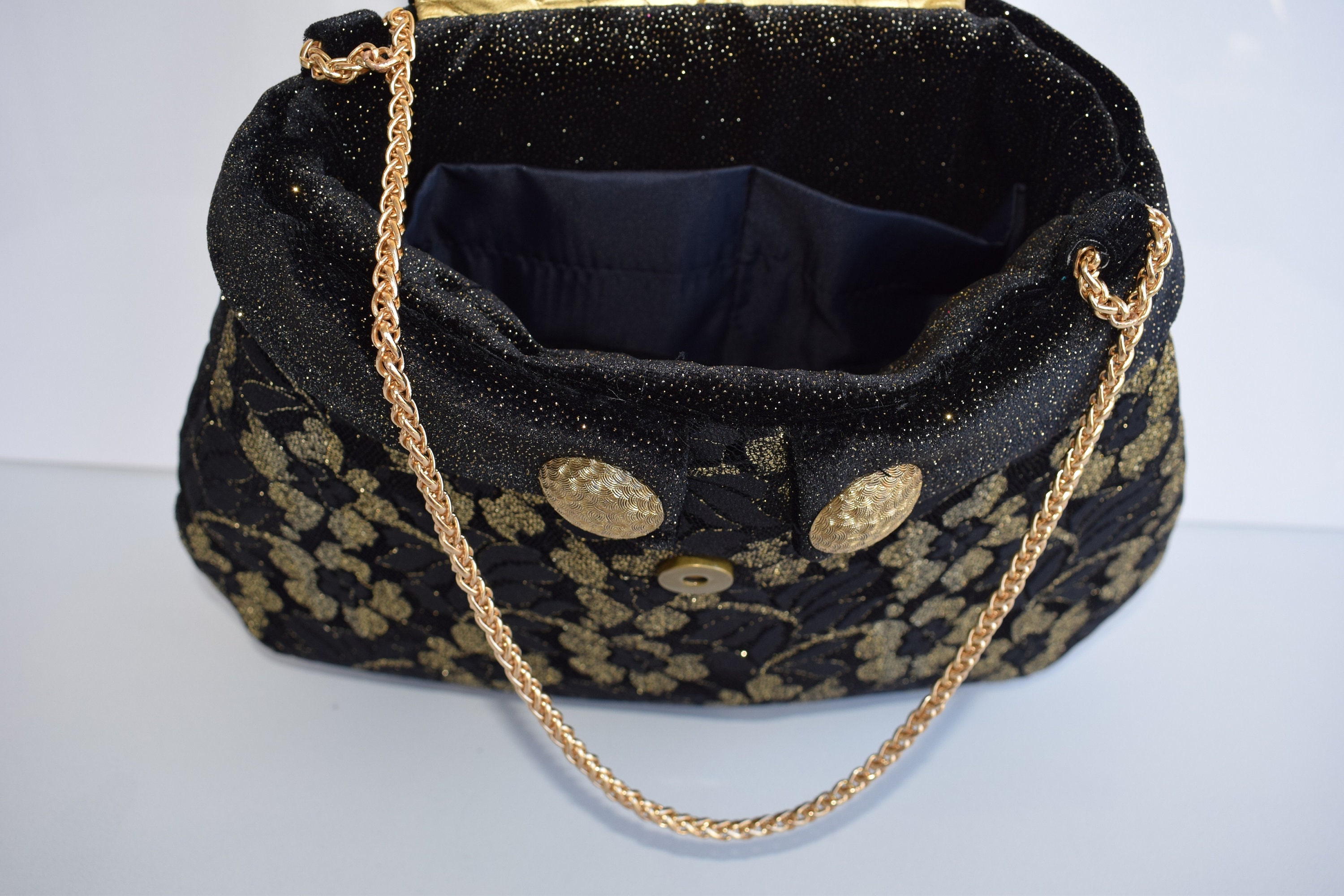 gold evening bag designer