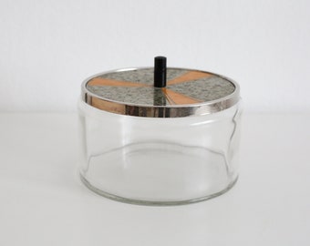 Vintage glass tin with patterned metal lid
