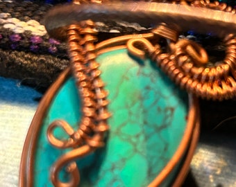 Wire wrapped pendant and cloth boho bag.