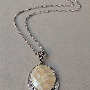 Necklace with white mother-of-pearl pendant and silver stainless steel chain
