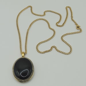 Long necklace with onyx medallion and gold stainless steel chain