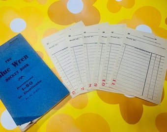 May include: A blue book with the title "The Blue Wren Docket Book" and the text "Numbered 1-50 in Duplicate" on the cover. There are six blank forms with the letter "M" and the word "Bought of" printed on them. The forms are numbered 6, 7, 8, 9, 10, and 11.