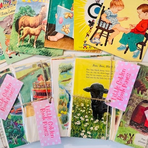 May include: A collection of vintage Little Golden Books and pages, featuring colorful illustrations of animals, children, and scenes. Some books are stacked, others are bundled with pink tags that read "Little Golden Book Pages".