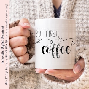 May include: White ceramic coffee mug with black text that reads "BUT FIRST, coffee" with an arrow pointing to the right.