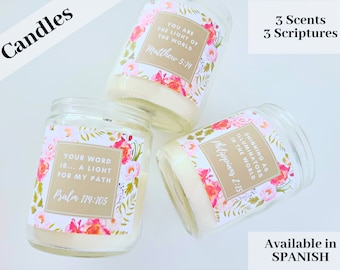 May include: Three glass candle jars with floral patterned labels and inspirational quotes. The labels are gold with white text. The quotes are "Your word is... a light for my path Psalm 119:105", "You are the light of the world Matthew 5:14", and "Shining as illuminators in the world Philippians 2:15".