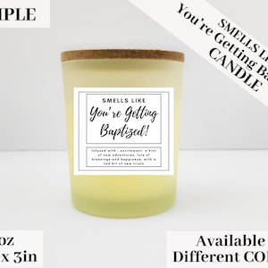 May include: A 3 ounce candle with a yellow glass jar and a cork lid. The label reads "Smells Like You're Getting Baptized!" and is infused with excitement, a hint of new adventures, lots of blessings and happiness, with a tad bit of new trials.