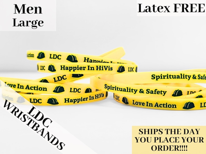 May include: Yellow rubber wristbands with black text and green construction worker helmet graphics. The text on the wristbands reads "LDC", "Happier In HiVis", "Spirituality & Safety", and "Love In Action".