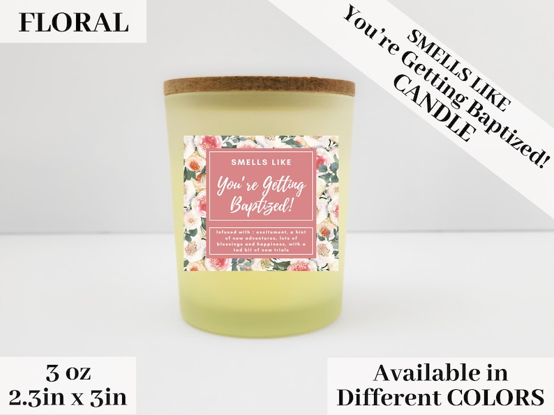 May include: A 3 ounce candle with a floral design and the text "Smells Like You're Getting Baptized!"  The candle is in a clear glass jar with a cork lid. The candle is available in different colors.