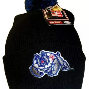May include: Black knit beanie with a blue pom pom on top. The beanie has a gray and blue embroidered bulldog logo with the letters "FB" on the front.
