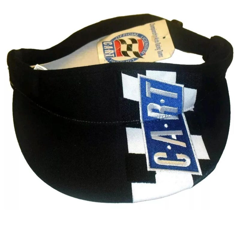 Pode incluir: Visor xadrez preto e branco com um logotipo "CART" azul. O visor &eacute; um produto oficial licenciado.