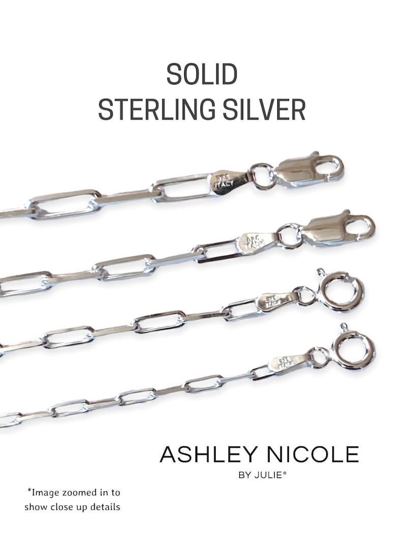 May include: Four different lengths of solid sterling silver chain necklaces with a lobster clasp closure. The chains are made of small, rectangular links. The image is zoomed in to show the details of the chains.