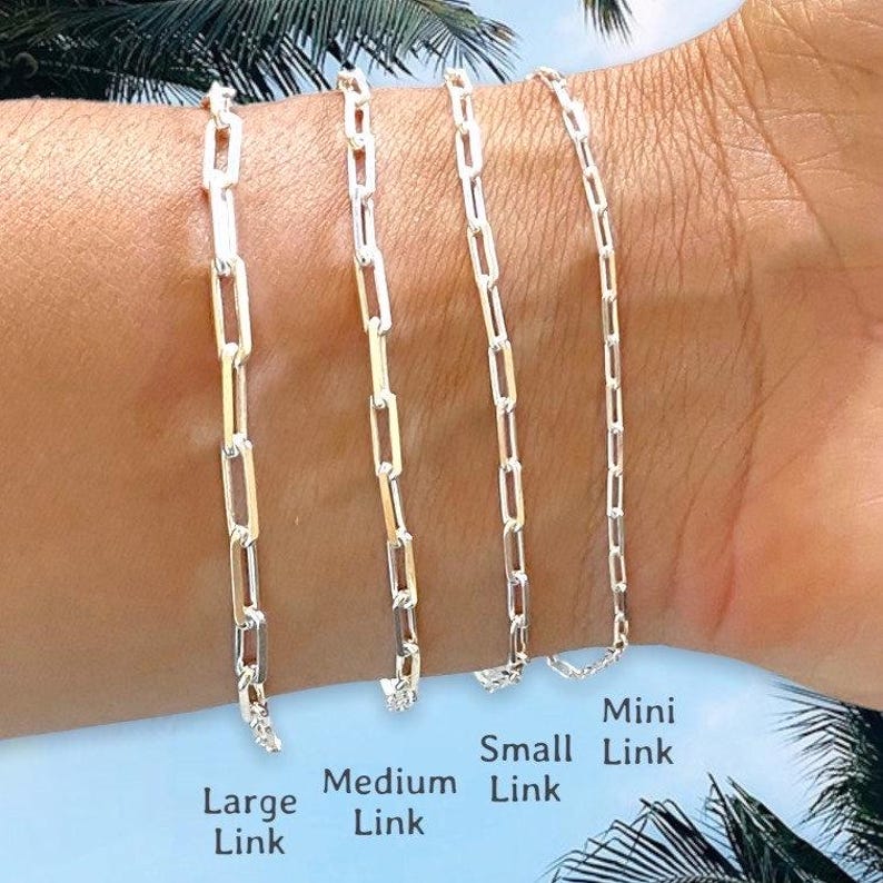 May include: Four silver chain bracelets of different sizes, labeled "Large Link", "Medium Link", "Small Link", and "Mini Link".