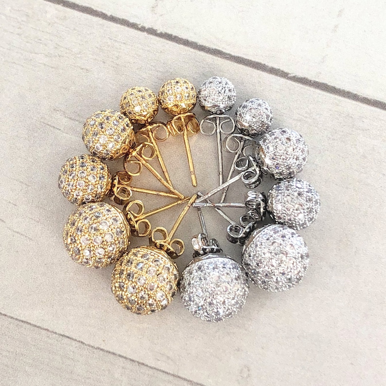 Disco Ball Earring studs with a, sparkly CZ Pave design. The studs are arranged in a circle, shown in 6mm, 8mm and 10mm sizes
