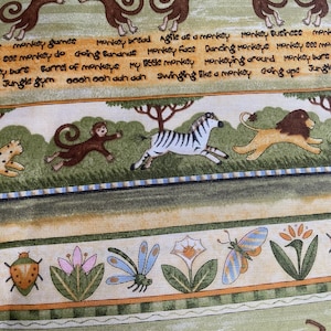 May include: A colorful fabric with a jungle theme. The fabric features monkeys, zebras, lions, butterflies, ladybugs, and flowers. The fabric also has text that says "monkey games", "monkey bread", "agile as a monkey", "monkey business", "monkey see monkey do", "going bananas", "monkey face", "dancing monkeys", "monkey see monkey do", "ey bars", "barrel of monkeys", "my little monkey", "monkeying around", "monkey bars", "jungle gym", "oooh ooh auh dah", "swinging like a monkey", "going ape", "jungle".