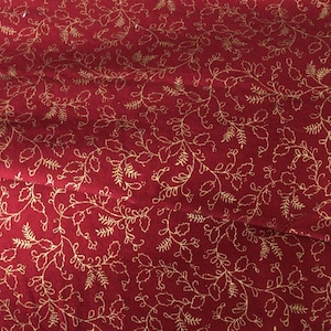 Vintage Holly and Berry print fabric on cranberry background