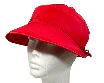 Cappello antipioggia impermeabile: tessuto Dintex antivento, vestibilità regolabile