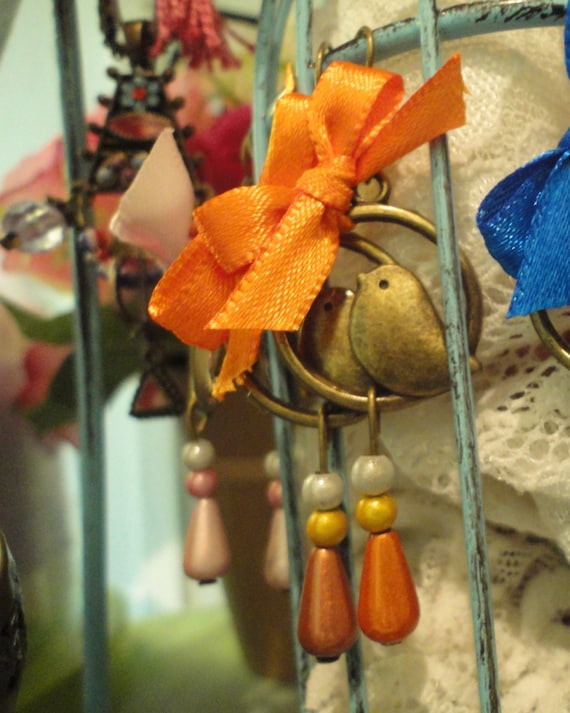 Bronze bird, iridescent pearls and satin ribbon earrings