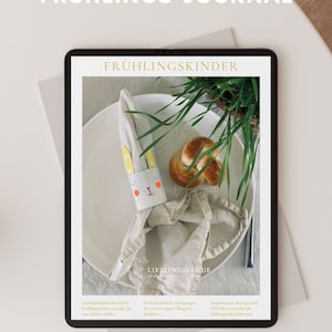 Może przedstawiać: Cyfrowy dziennik z wiosennymi aktywnościami dla dzieci. Okładka przedstawia biały talerz z serwetką złożoną w kształt królika. Talerz stoi na stole z zieloną rośliną w tle. Tekst na okładce brzmi "Digitales Frühlings-Journal" i "Frühlingskinder".