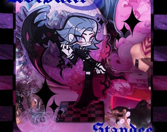 May include: A clear acrylic standee featuring a cartoon character with blue hair, glasses, and a black outfit. The standee has a black wing-like design and the text "Aotsuki" and "Standee". The base is a checkered pattern.