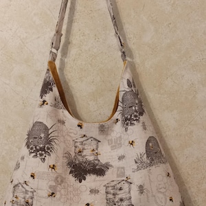 Bolso Hobo, bolso de hombro estilo hobo de lona estilo vintage Beehives, bolso de mano grande estilo hobo, bolso bohemio en gris neutro, marrón y beige con abejorros amarillos.