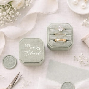 May include: A handmade, wooden cutting board with a natural finish. The board features a live edge on one side and a smooth, rectangular shape. It is approximately 18 inches long and 12 inches wide.