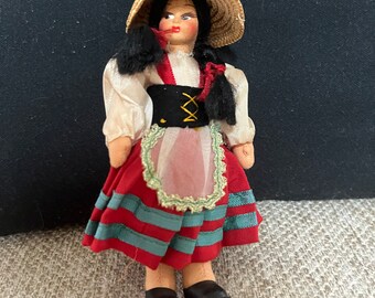 Vintage collectible doll with pigtails, straw hat, celluloid face