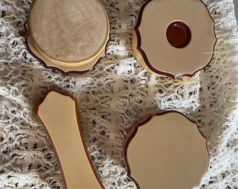 Vanity set, cream colored beauty set, brush , makeup holders, powder puff. Very good vintage condition