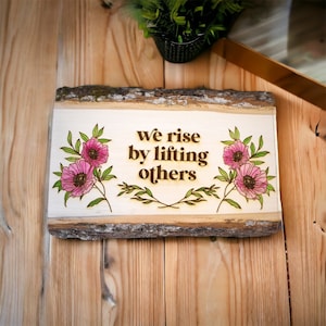 We Rise By Lifting Others Hand Painted Floral Laser Engraved Sign