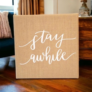 Stay Awhile Rustic Farmhouse Hand Lettered Calligraphy Quote on Burlap Canvas