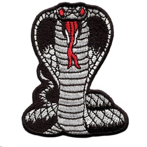 May include: Embroidered iron-on patch of a black and white cobra with a red tongue, in a coiled position.