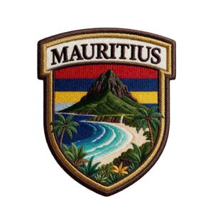 May include: A shield-shaped embroidered patch featuring the text MAURITIUS in black letters on a white background. The design depicts a tropical landscape with a green mountain, a sandy beach, blue ocean waves, and palm trees in vibrant colors.