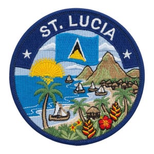 May include: Embroidered patch featuring a coastal scene with palm trees, sailboats, and a beach, with the text "ST. LUCIA" at the top. The design includes a flag, mountains, and a sun. The patch is circular with a blue border and white stars.