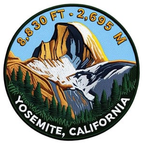 May include: Embroidered patch featuring a mountain landscape with the text "Yosemite, California." The patch includes the text "8,830 FT - 2,695 M" around the top edge. The design features a mountain, trees, and a blue sky.