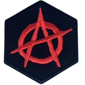 May include: A red anarchy symbol embroidered on a black hexagonal patch.