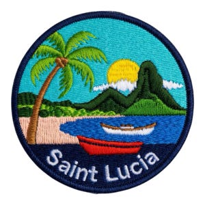 May include: Embroidered patch depicting a tropical island scene. A palm tree, beach, and ocean are shown with a red boat and a white boat. The text "Saint Lucia" is in white lettering on a navy blue border.