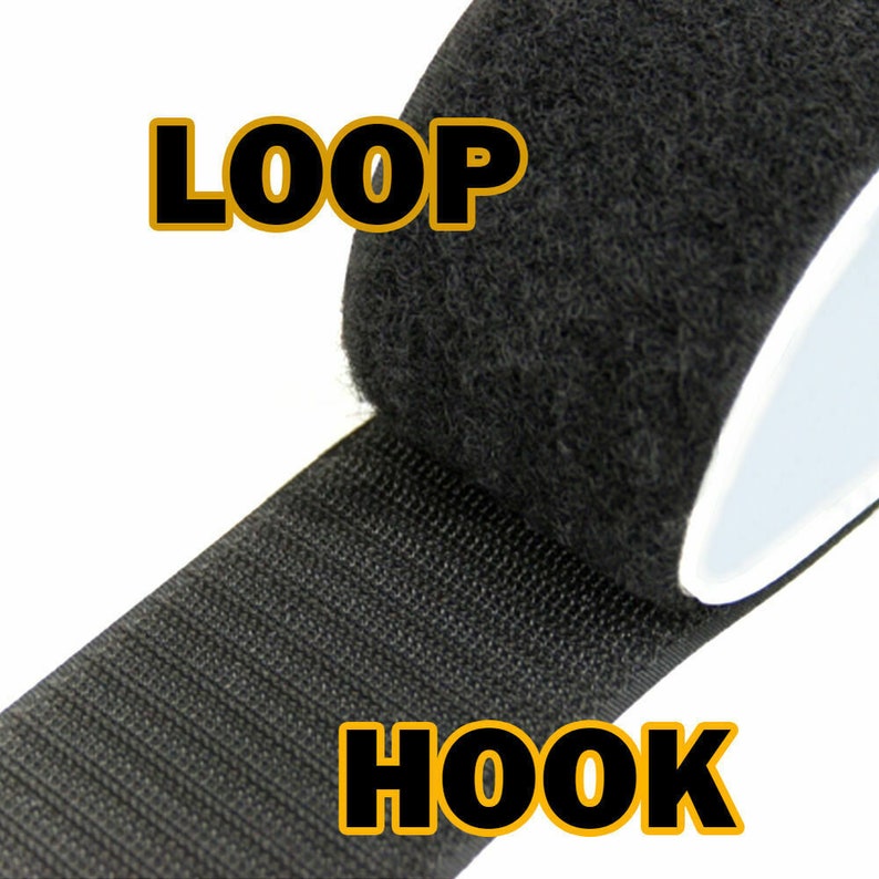 May include: Black hook and loop tape. The tape is rolled up and the hook side is visible. The loop side is labeled "LOOP" and the hook side is labeled "HOOK".