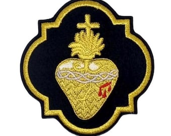 May include: Gold embroidered patch with a black background featuring a stylized heart with a crown of thorns, a cross, and a flame. The heart is surrounded by a gold rope and has red drops of blood.
