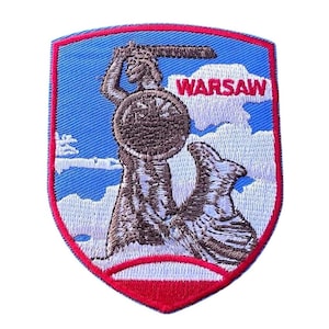 May include: Embroidered patch featuring the Warsaw mermaid, holding a sword and shield, set against a blue sky with clouds. The word "WARSAW" is above the mermaid. The patch has a red and white border.